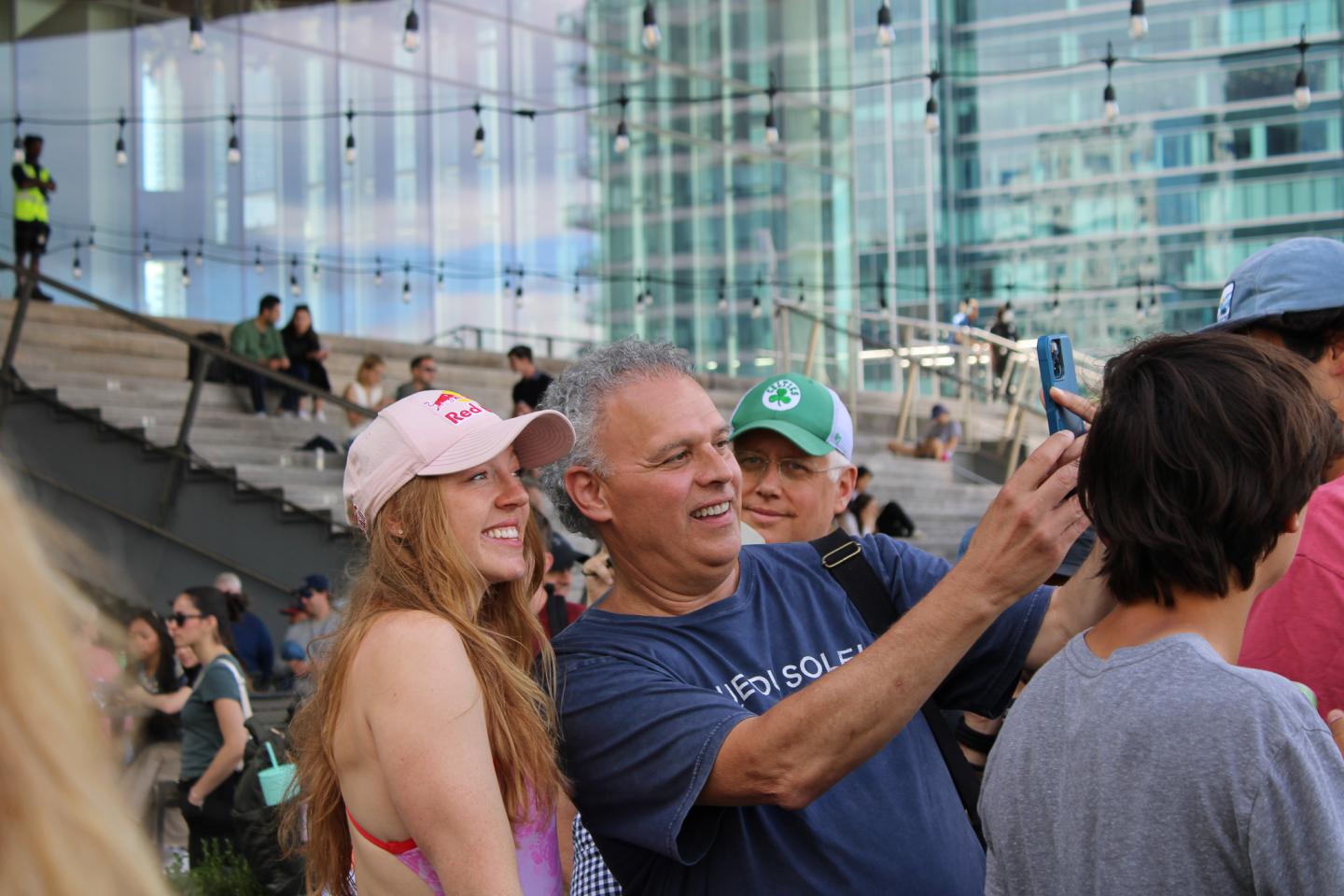 Molly Carlson takes a photo with a fan at the Red Bull Cliff Diving World Series in Boston