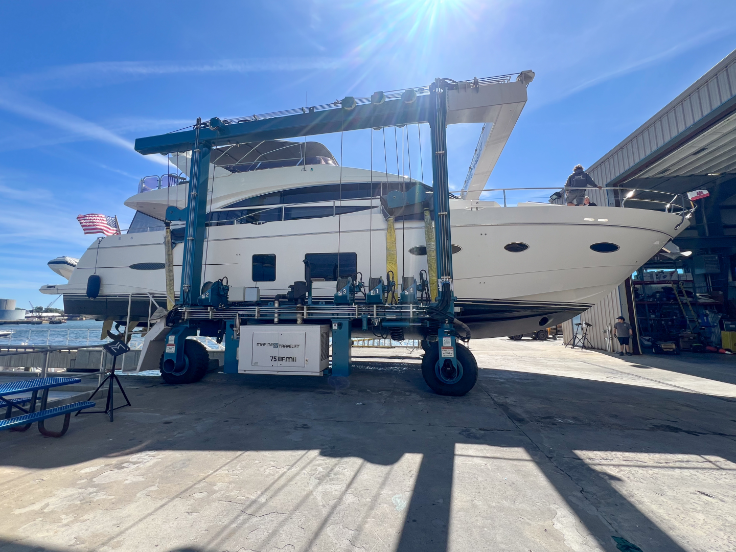 Boat in lift at Boston Marine Services
