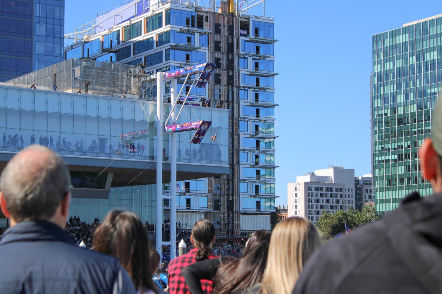 Spectators watch Red Bull Cliff Diving at Fan Pier Marina