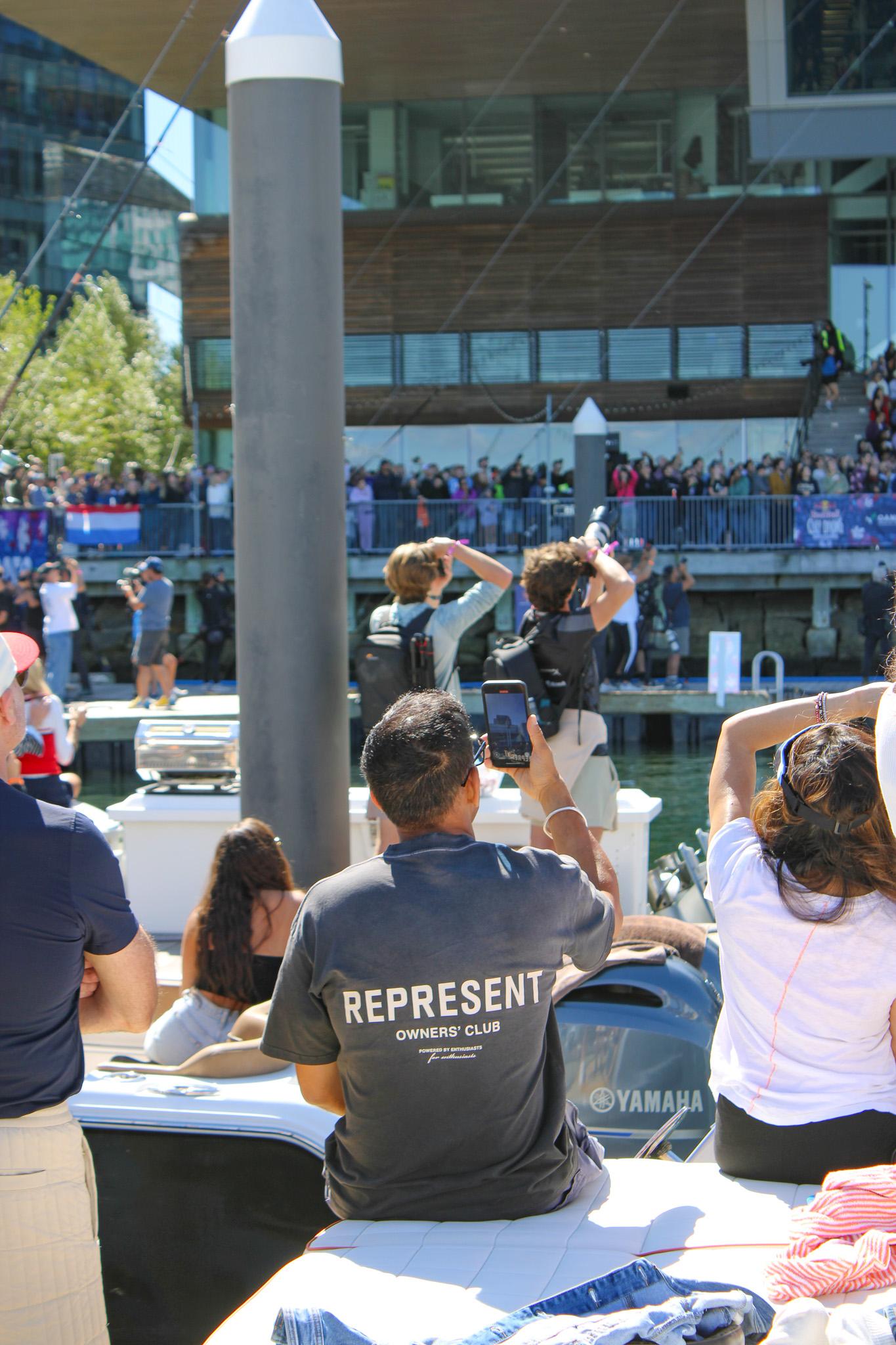 Spectators watch Red Bull Cliff Diving at Fan Pier Marina